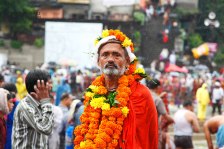 SADHU WITH THE MARIGOLD FLOWERS